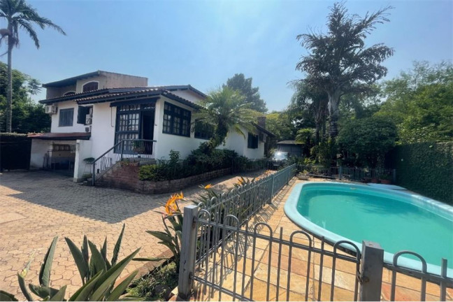 Imagem Casa com 4 Quartos à Venda, 525 m² em Jardim Sabará - Porto Alegre Imagem Casa com 4 Quartos à Venda, 525 m² em Jardim Sabará - Porto Alegre