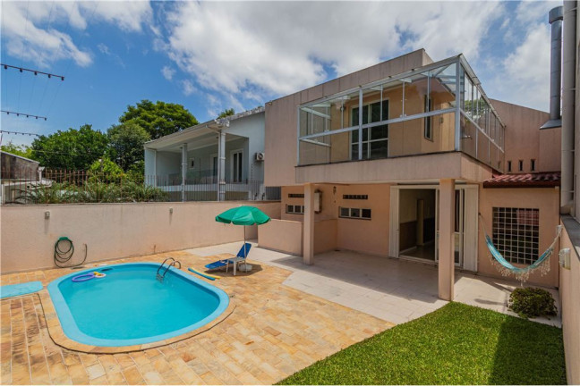 Imagem Casa com 4 Quartos à Venda, 330 m² em Nonoai - Porto Alegre Imagem Casa com 4 Quartos à Venda, 330 m² em Nonoai - Porto Alegre