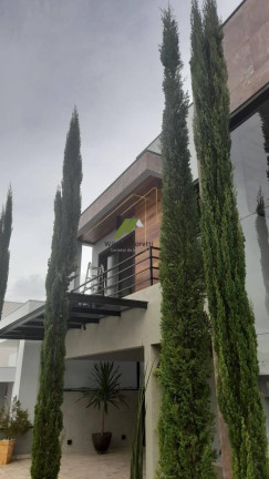 Imagem Casa de Condomínio com 4 Quartos à Venda, 239 m²