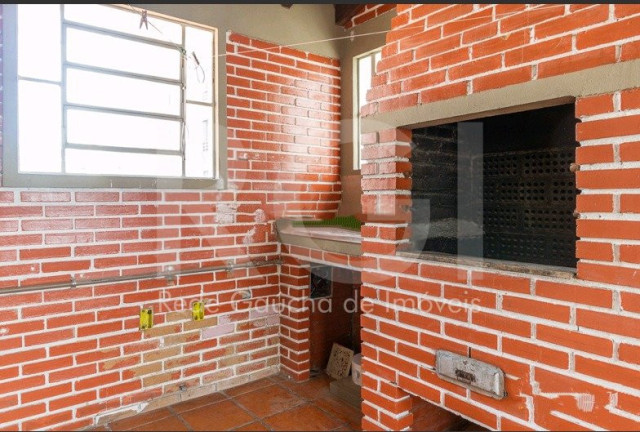 Imagem Casa com 5 Quartos à Venda, 299 m² em Menino Deus - Porto Alegre