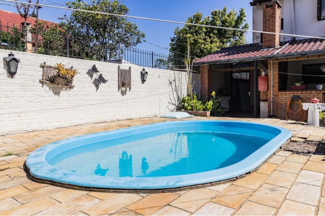Imagem Casa com 3 Quartos à Venda, 235 m² em Guarujá - Porto Alegre Imagem Casa com 3 Quartos à Venda, 235 m² em Guarujá - Porto Alegre