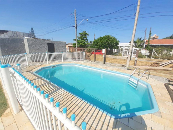 Imagem Casa com 4 Quartos à Venda, 120 m² em Xangri-lá Imagem Casa com 4 Quartos à Venda, 120 m² em Xangri-lá