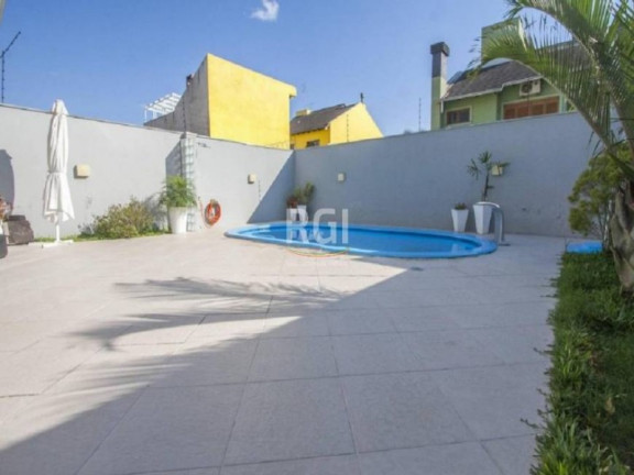 Imagem Casa com 4 Quartos à Venda, 369 m² em Sarandi - Porto Alegre Imagem Casa com 4 Quartos à Venda, 369 m² em Sarandi - Porto Alegre