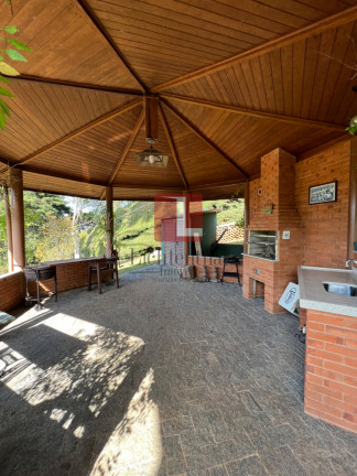 Imagem Casa de Condomínio com 4 Quartos à Venda, 260 m² em Vale Encantado - Campos Do Jordão