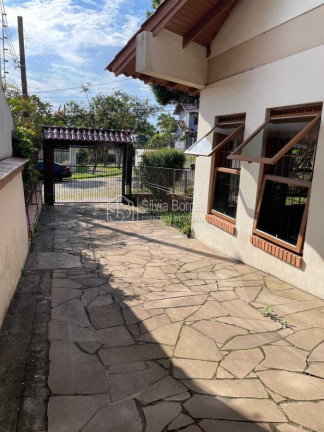 Imagem Sobrado com 3 Quartos à Venda, 209 m² em Ipanema - Porto Alegre