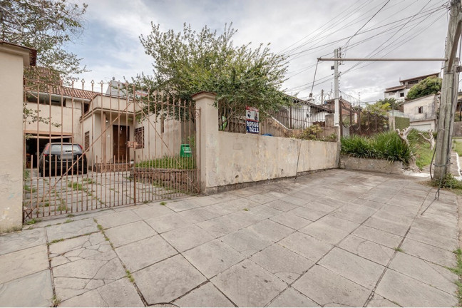 Imagem Casa com 4 Quartos à Venda, 170 m² em Vila Nova - Porto Alegre Imagem Casa com 4 Quartos à Venda, 170 m² em Vila Nova - Porto Alegre