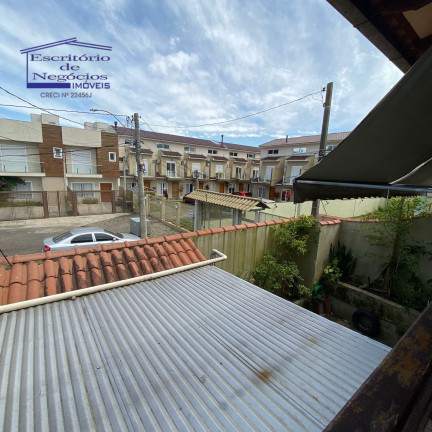 Imagem Casa com 3 Quartos à Venda, 192 m² em Vila Nova - Porto Alegre Imagem Casa com 3 Quartos à Venda, 192 m² em Vila Nova - Porto Alegre