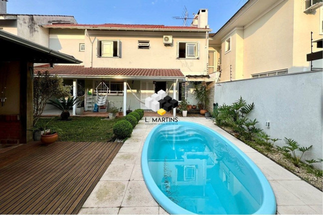 Imagem Casa com 4 Quartos à Venda, 243 m² em Moinhos De Vento - Canoas Imagem Casa com 4 Quartos à Venda, 243 m² em Moinhos De Vento - Canoas