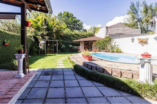 Imagem Casa com 3 Quartos à Venda, 235 m² em Guarujá - Porto Alegre Imagem Casa com 3 Quartos à Venda, 235 m² em Guarujá - Porto Alegre