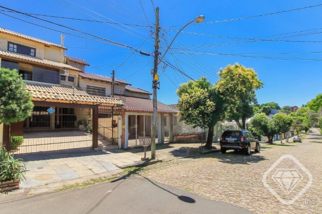 Imagem Casa com 3 Quartos à Venda, 198 m² em Cavalhada - Porto Alegre Imagem Casa com 3 Quartos à Venda, 198 m² em Cavalhada - Porto Alegre