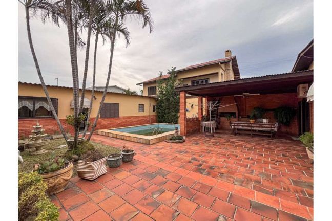 Imagem Casa com 3 Quartos à Venda, 119 m² em Igara - Canoas Imagem Casa com 3 Quartos à Venda, 119 m² em Igara - Canoas
