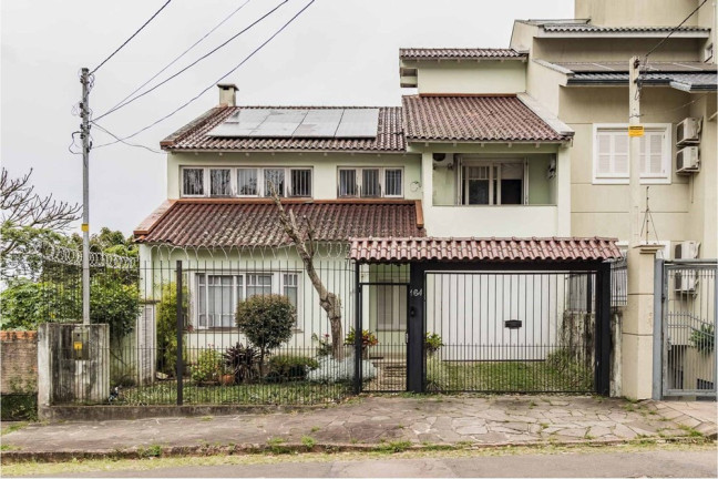 Imagem Casa com 3 Quartos à Venda, 464 m² em Santo Antônio - Porto Alegre Imagem Casa com 3 Quartos à Venda, 464 m² em Santo Antônio - Porto Alegre