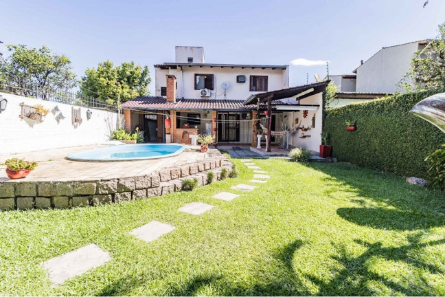 Imagem Casa com 3 Quartos à Venda, 235 m² em Guarujá - Porto Alegre Imagem Casa com 3 Quartos à Venda, 235 m² em Guarujá - Porto Alegre