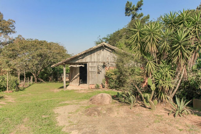 Imagem Casa com 4 Quartos à Venda, 200 m² em Vila Nova - Porto Alegre Imagem Casa com 4 Quartos à Venda, 200 m² em Vila Nova - Porto Alegre