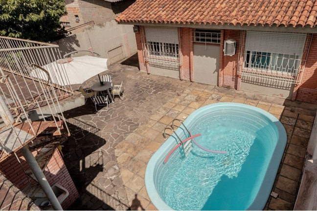Imagem Casa com 4 Quartos à Venda, 381 m² em Camaquã - Porto Alegre Imagem Casa com 4 Quartos à Venda, 381 m² em Camaquã - Porto Alegre