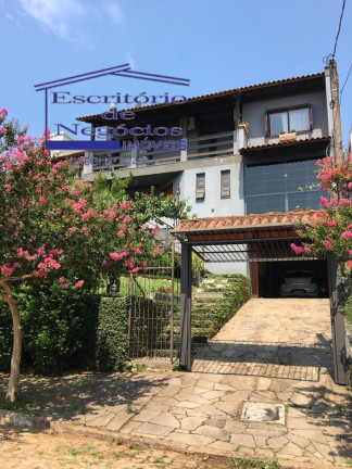 Imagem Casa com 3 Quartos à Venda, 195 m² em Teresópolis - Porto Alegre Imagem Casa com 3 Quartos à Venda, 195 m² em Teresópolis - Porto Alegre